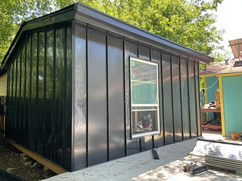 Black standing seam metal wall panels for Roof Inspection in Urbandale