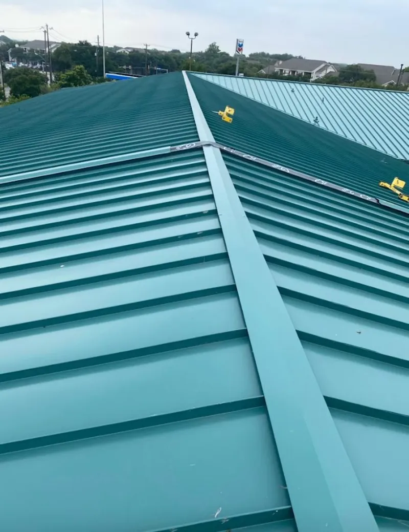 Green commercial metal roof ridge and valley for Metal Roof Repair in Urbandale